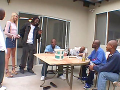 Mini-skirt clad blonde with petite gorgeous tits enjoying an interracial gangbang