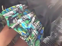 Slim chick wearing a miniskirt gets caught on a hidden cam