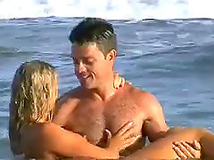 Nude blonde has fun with her BF on a beach in outdoor scene