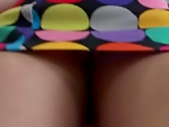 Amateur girl wearing a miniskirt gets caught on a voyeur's cam