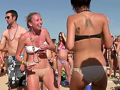 Babes at the beach party showing off ass and tits in bikini