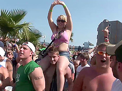 Amateur chicks wearing bikinis get caught on voyeur's cam on a beach