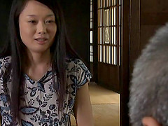 This guy gets on top of his Japanese wife and fucks her until she cums