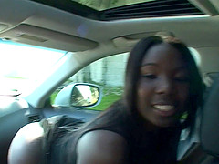 Refined ebony babe with long hair gets her face fucked in the car