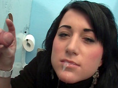 Sweater girl at the gloryhole gladly makes his cock cum