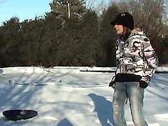 Britney Spring plays in the snow in some very tight jeans