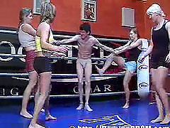 Shorts-clad babe with a curvy body kicking and torturing a guy