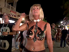 Ladies at Mardi Gras demonstrate their sexy body paint