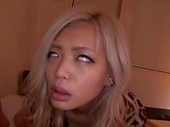 Sexy Asian chick with long blonde hair enjoying a hardcore missionary style fuck