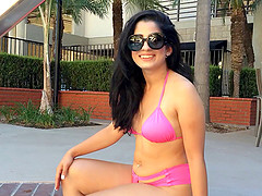 Hot brunette basks by the poolside ahead of a thorough nailing in a reality shoot