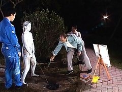 Unknown Model nude and covered in paint to pose as a statue