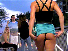 Scantily clad cutie strips fully nude in public