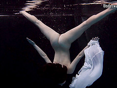 Andrejka slowly takes down her skirt while diving in the pool