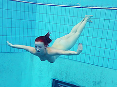 Long hair solo model with natural tits swimming showing off her nice ass
