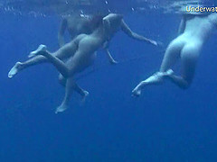 Two foxy slim stunners enjoy revealing their bodies in the ocean