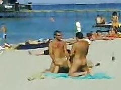 Two Guys and One Sexy Babe Have a Hot Threesome on a Nude Beach