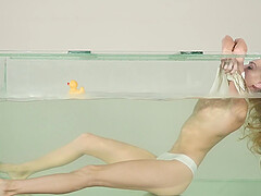 Blonde darling Nancy A loves to play with her pussy in the pool