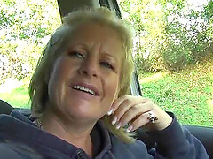 Naughty mature Robyn Ryder spreads her legs in the car to play